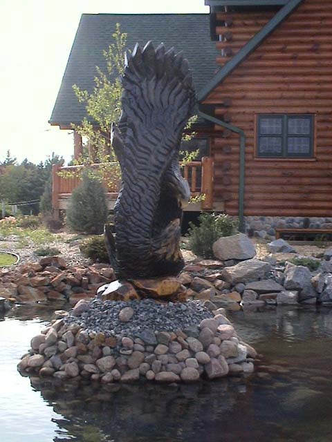 Eagles Fighting on Rocks in Pond